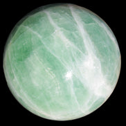 Green Fluorite sphere 108mm 2056g in sunlight - Rocks and Things Store