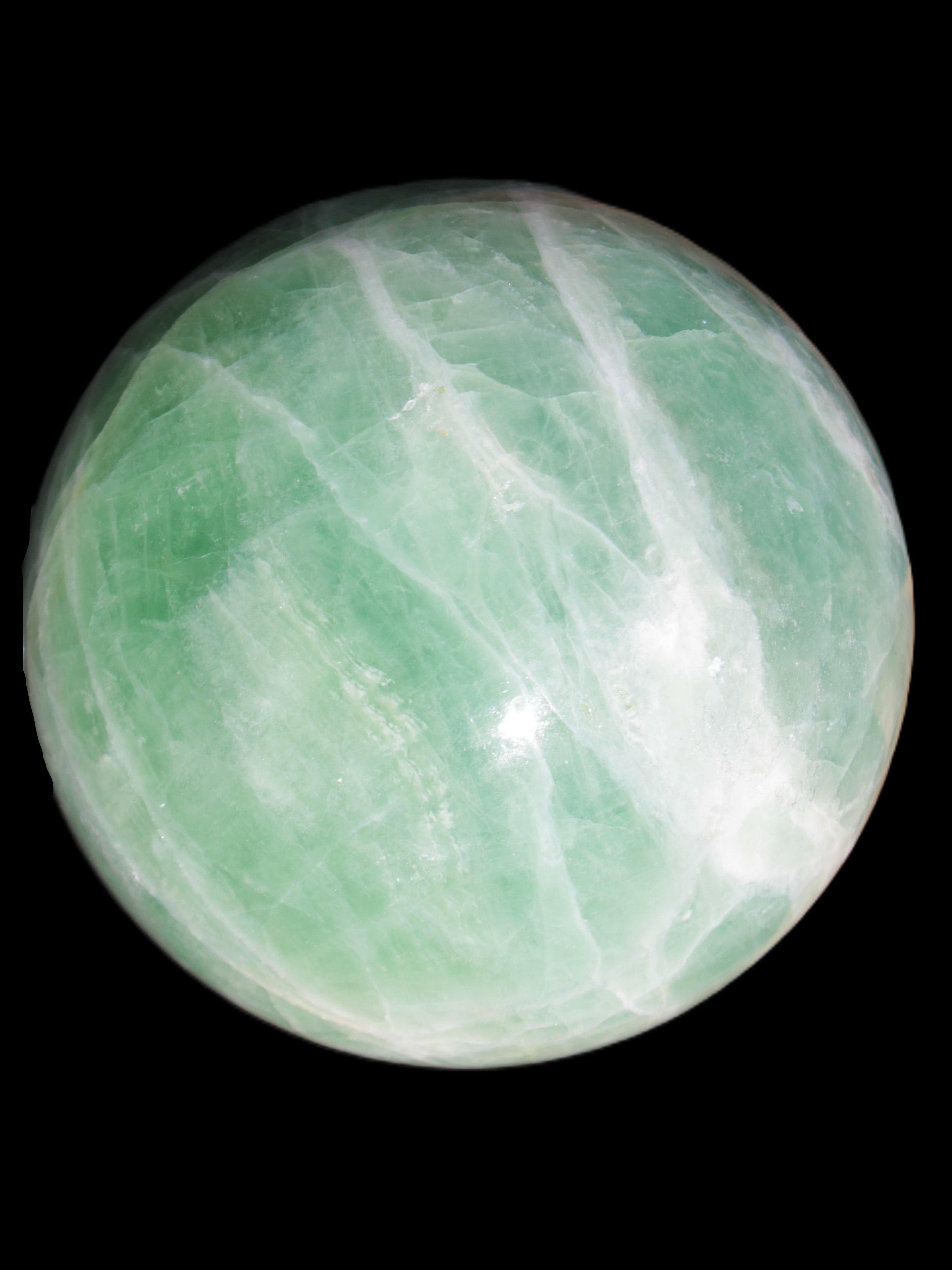 Green Fluorite sphere 108mm 2056g in sunlight - Rocks and Things Store