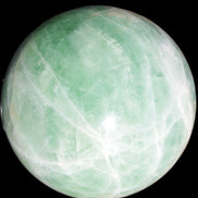 Green Fluorite sphere 108mm 2056g in sunlight - Rocks and Things Store