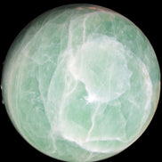Green Fluorite sphere 108mm 2056g in sunlight - Rocks and Things Store