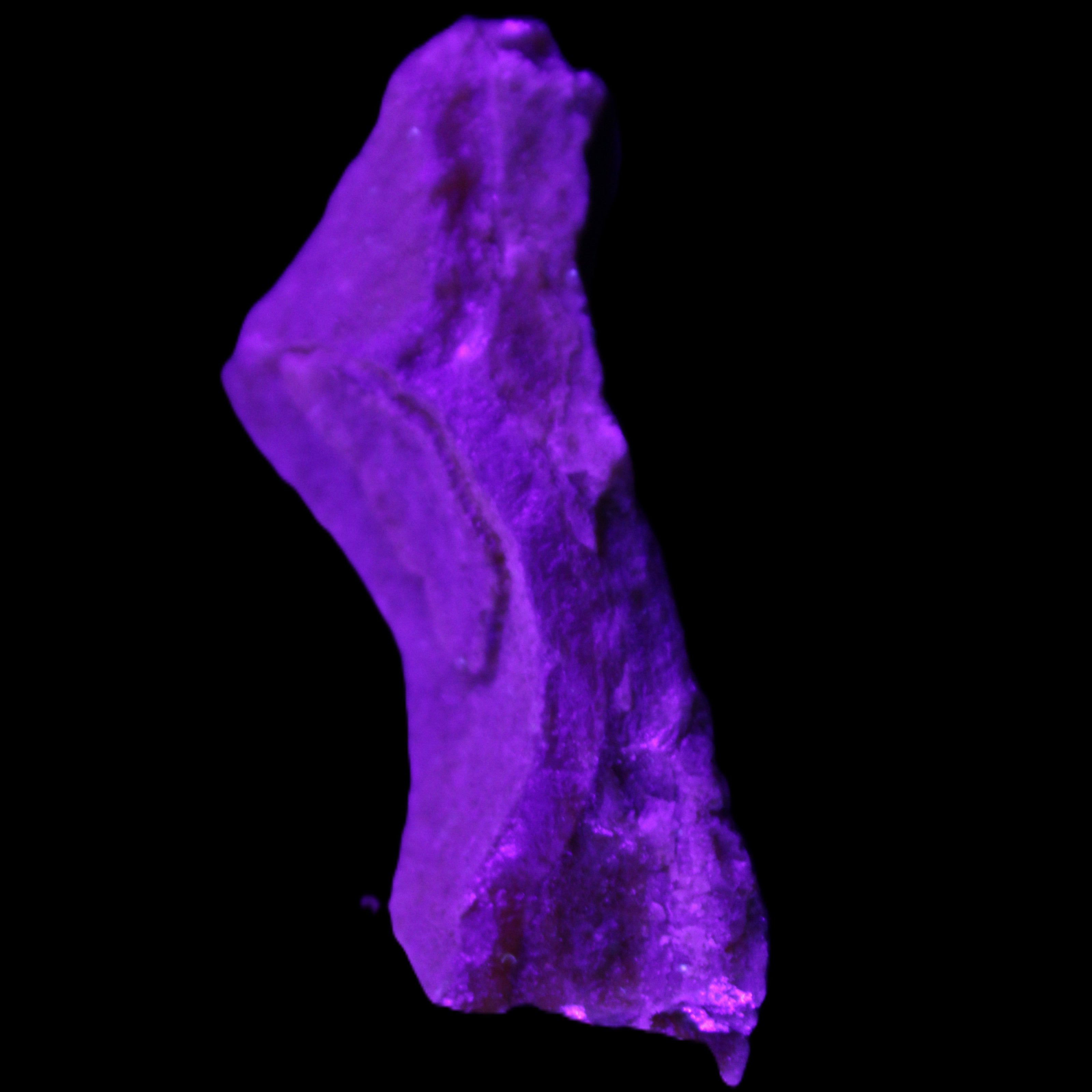 Pink Rhodochrosite crystal 60*23*10mm 27.6g in UV light - Rocks and Things Store