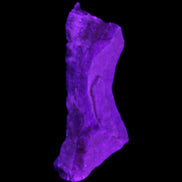 Pink Rhodochrosite crystal 60*23*10mm 27.6g in UV light - Rocks and Things Store