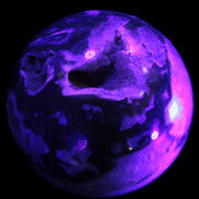 Moss Agate sphere from Madagascar 108mm 1673g in UV light -  Rocks and Things Store