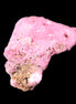 Ruby UV reactive cluster 50*39*11mm 52g in bright sunlight - Rocks and Things
