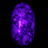 Llanite Que Sera palm stone 52*17*35mm 55g in sunlight - Rocks and Things Store