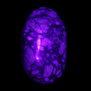 Llanite Que Sera palm stone 52*17*35mm 55g in UV light