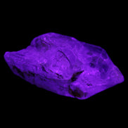 Fenster Golden Diamond Quartz with hydrocarbons & enhydros 33-50mm 10-14.3g in UV light - Rocks and Things Store