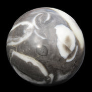Thousand Eye Stone sphere 66mm 404g in sunlight - Rocks and Things Store