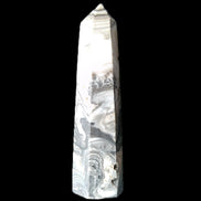 Zebra Calcite wand 79mm 45g in sunlight - Rocks and Things Store