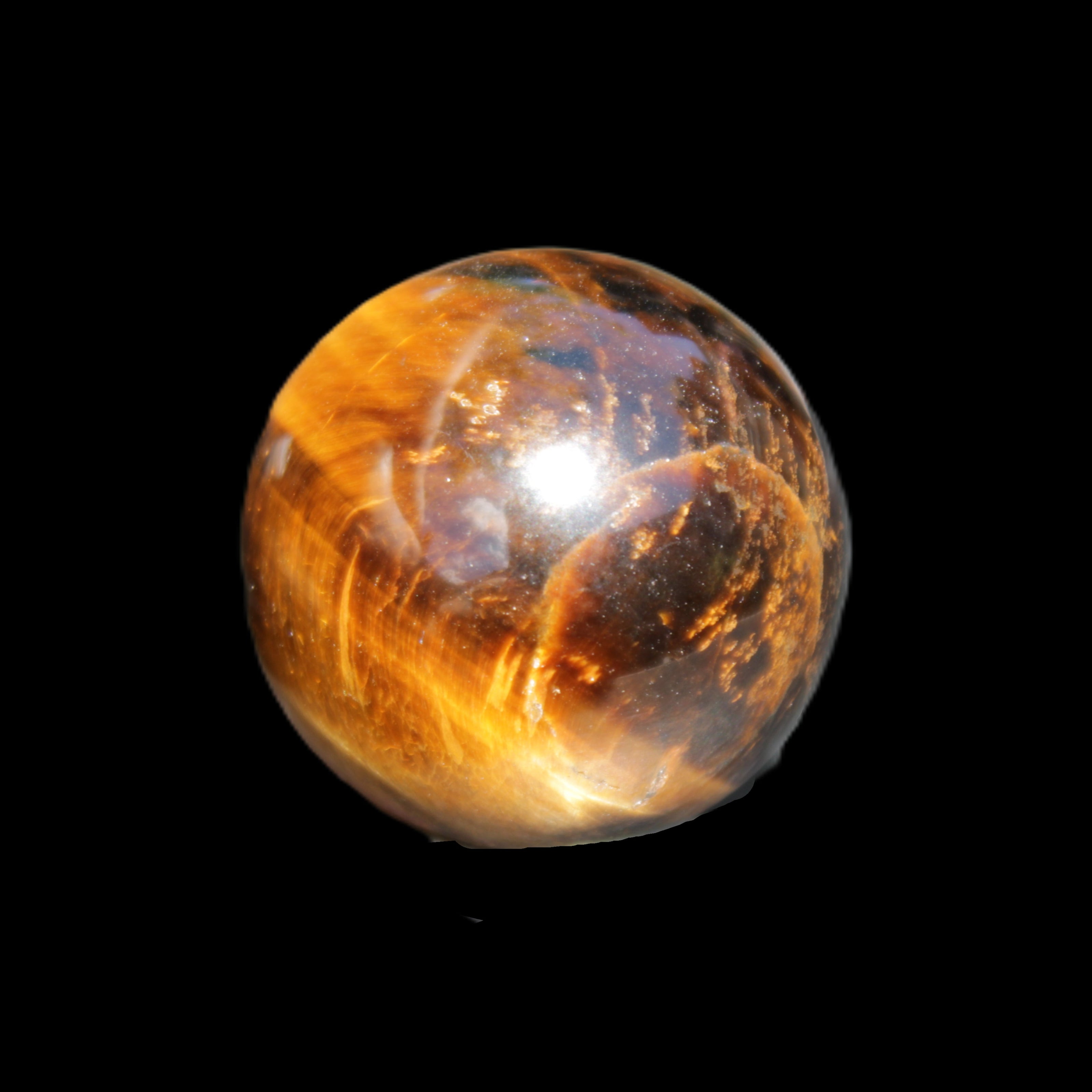 Golden Tigers Eye sphere 35mm 59g in sunlight - Rocks and Things Store