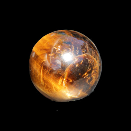 Golden Tigers Eye sphere 35mm 59g in sunlight - Rocks and Things Store