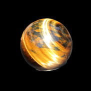 Golden Tigers Eye sphere 35mm 59g in sunlight - Rocks and Things Store