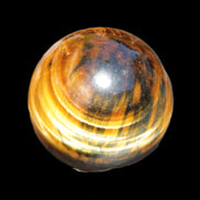 Golden Tigers Eye sphere 35mm 59g in sunlight - Rocks and Things Store
