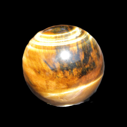 Golden Tigers Eye sphere 35mm 59g in sunlight - Rocks and Things Store