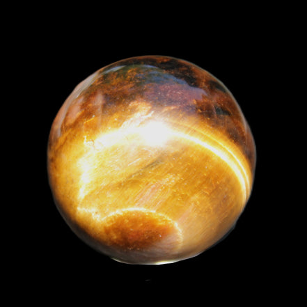 Golden Tigers Eye sphere 35mm 59g in sunlight - Rocks and Things Store