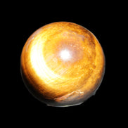 Golden Tigers Eye sphere 35mm 59g in sunlight - Rocks and Things Store