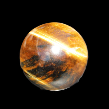 Golden Tigers Eye sphere 35mm 59g in sunlight - Rocks and Things Store