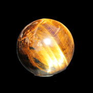 Golden Tigers Eye sphere 35mm 59g in sunlight - Rocks and Things Store