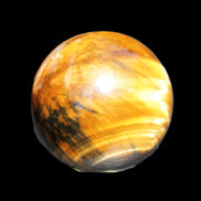 Golden Tigers Eye sphere 35mm 59g in sunlight - Rocks and Things Store