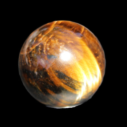 Golden Tigers Eye sphere 35mm 59g in sunlight - Rocks and Things Store