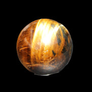 Golden Tigers Eye sphere 35mm 59g in sunlight - Rocks and Things Store