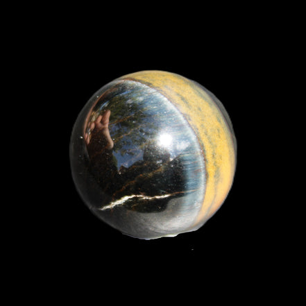 Blue Tigers Eye sphere 32mm 49g in sunlight - Rocks and Things Store
