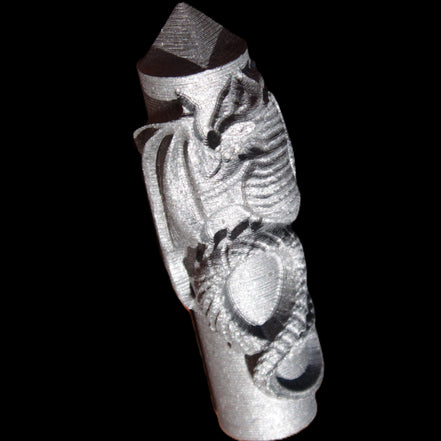 Imitation Shungite hand carved dragon 83g in sunlight - Rocks and Things Store