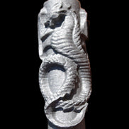 Imitation Shungite hand carved dragon 83g in sunlight - Rocks and Things Store