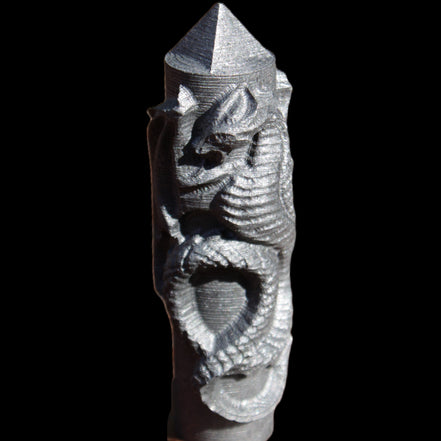 Imitation Shungite hand carved dragon 83g in sunlight - Rocks and Things Store