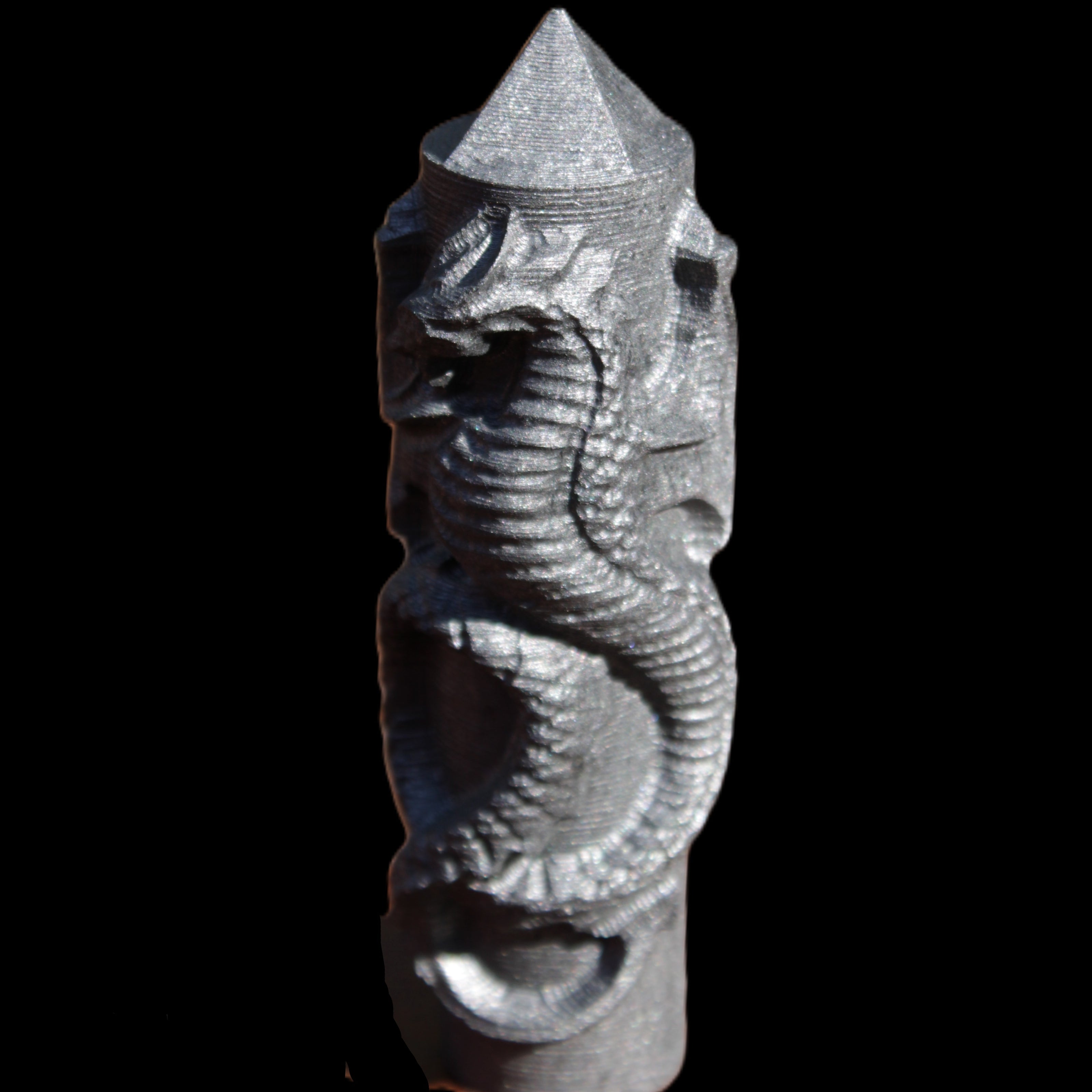 Imitation Shungite hand carved dragon 83g in sunlight - Rocks and Things Store