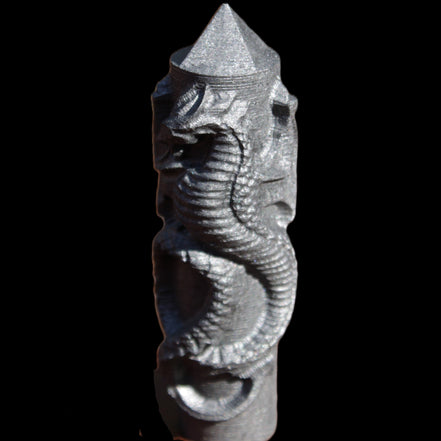 Imitation Shungite hand carved dragon 83g in sunlight - Rocks and Things Store