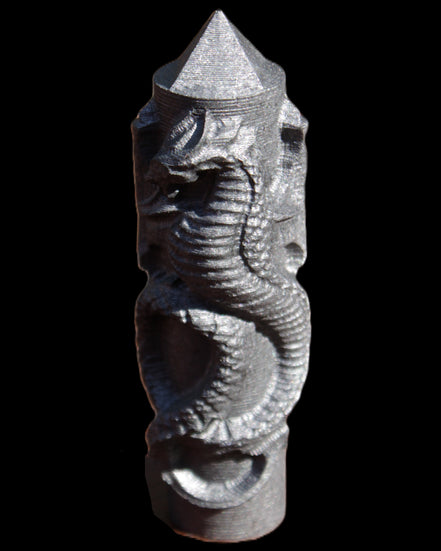 Imitation Shungite hand carved dragon 83g in sunlight - Rocks and Things Store