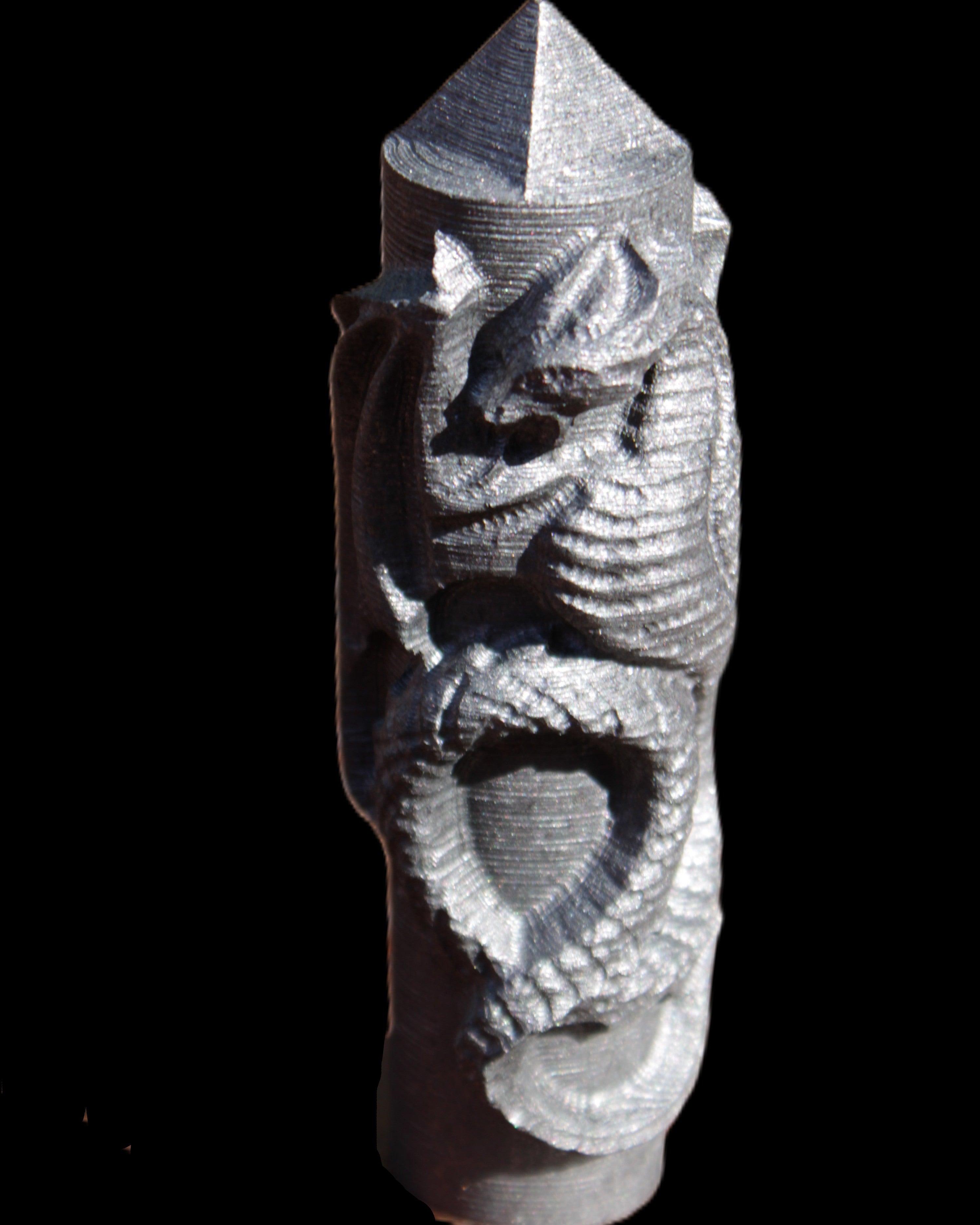 Imitation Shungite hand carved dragon 83g in sunlight - Rocks and Things Store