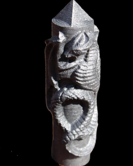 Imitation Shungite hand carved dragon 83g in sunlight - Rocks and Things Store