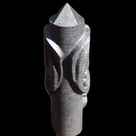 Imitation Shungite hand carved dragon 83g in sunlight - Rocks and Things Store