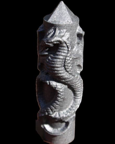 Imitation Shungite hand carved dragon 83g in sunlight - Rocks and Things Store