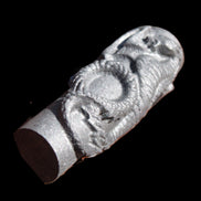 Imitation Shungite hand carved dragon 83g in sunlight - Rocks and Things Store