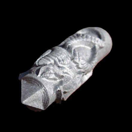 Imitation Shungite hand carved dragon 83g in sunlight - Rocks and Things Store