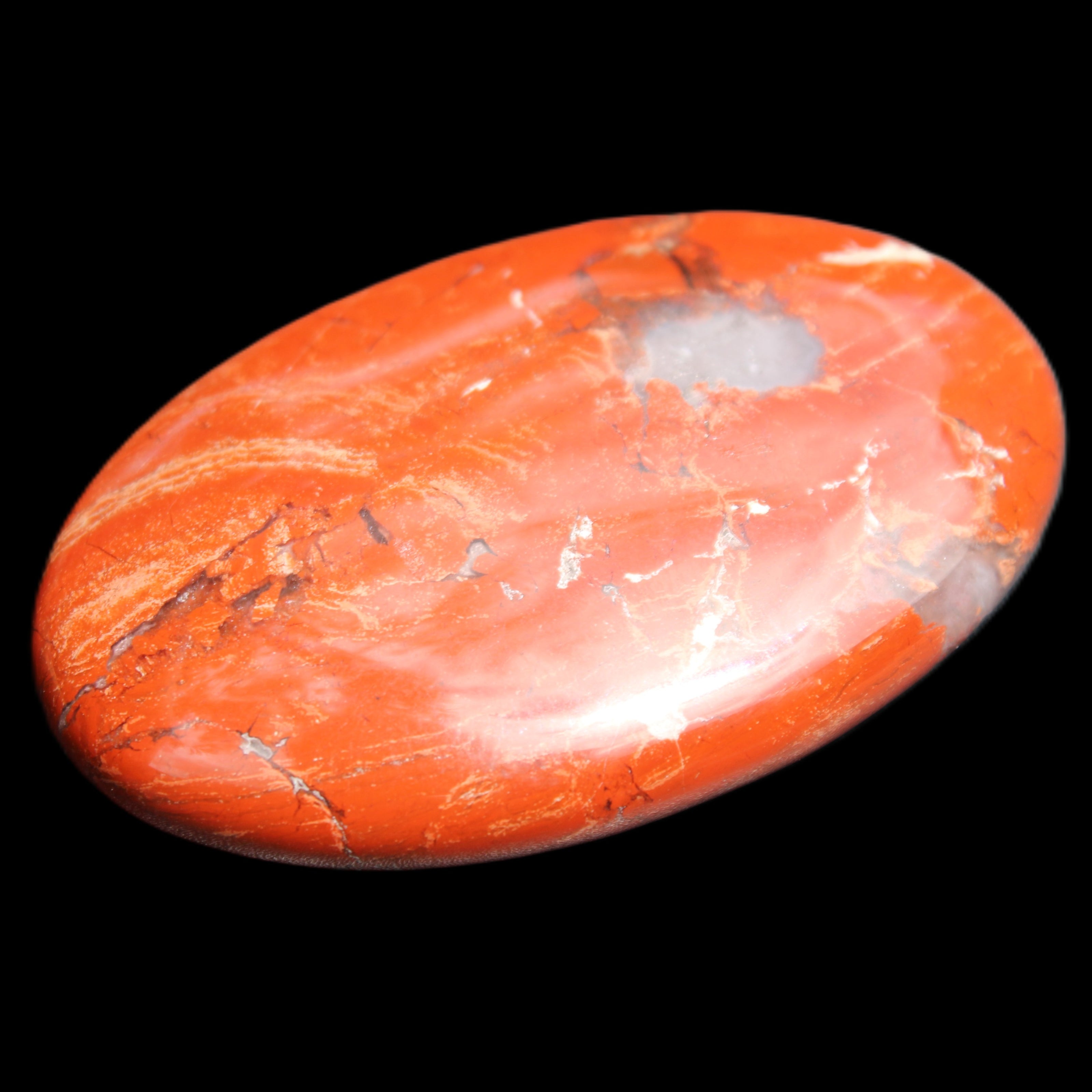 Red Jasper palmstone 56mm 45g in sunlight - Rocks and Things Store