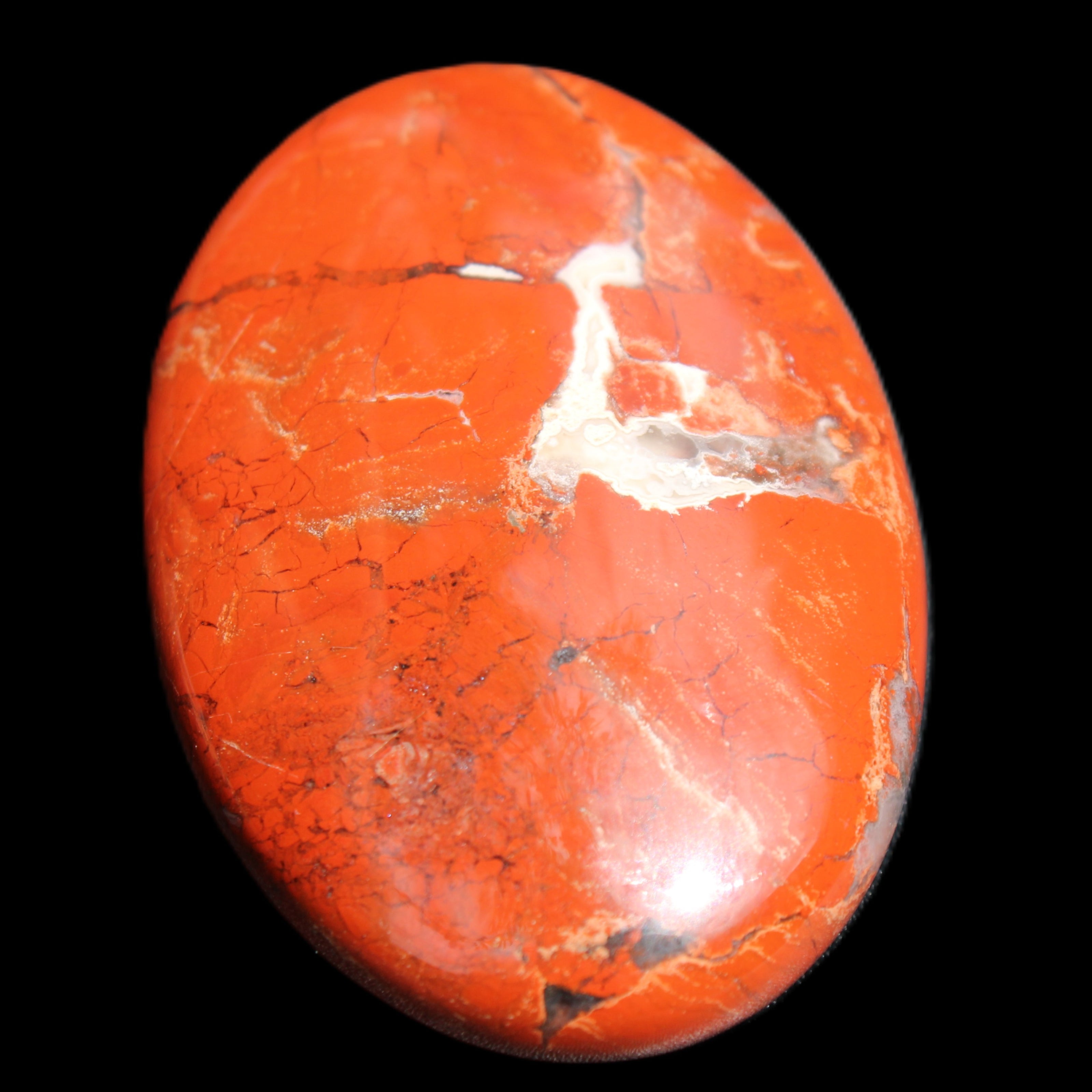 Red Jasper palmstone 56mm 45g in sunlight - Rocks and Things Store