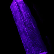 Astrophyllite wand 88mm 100g in UV light - Rocks and Things Store