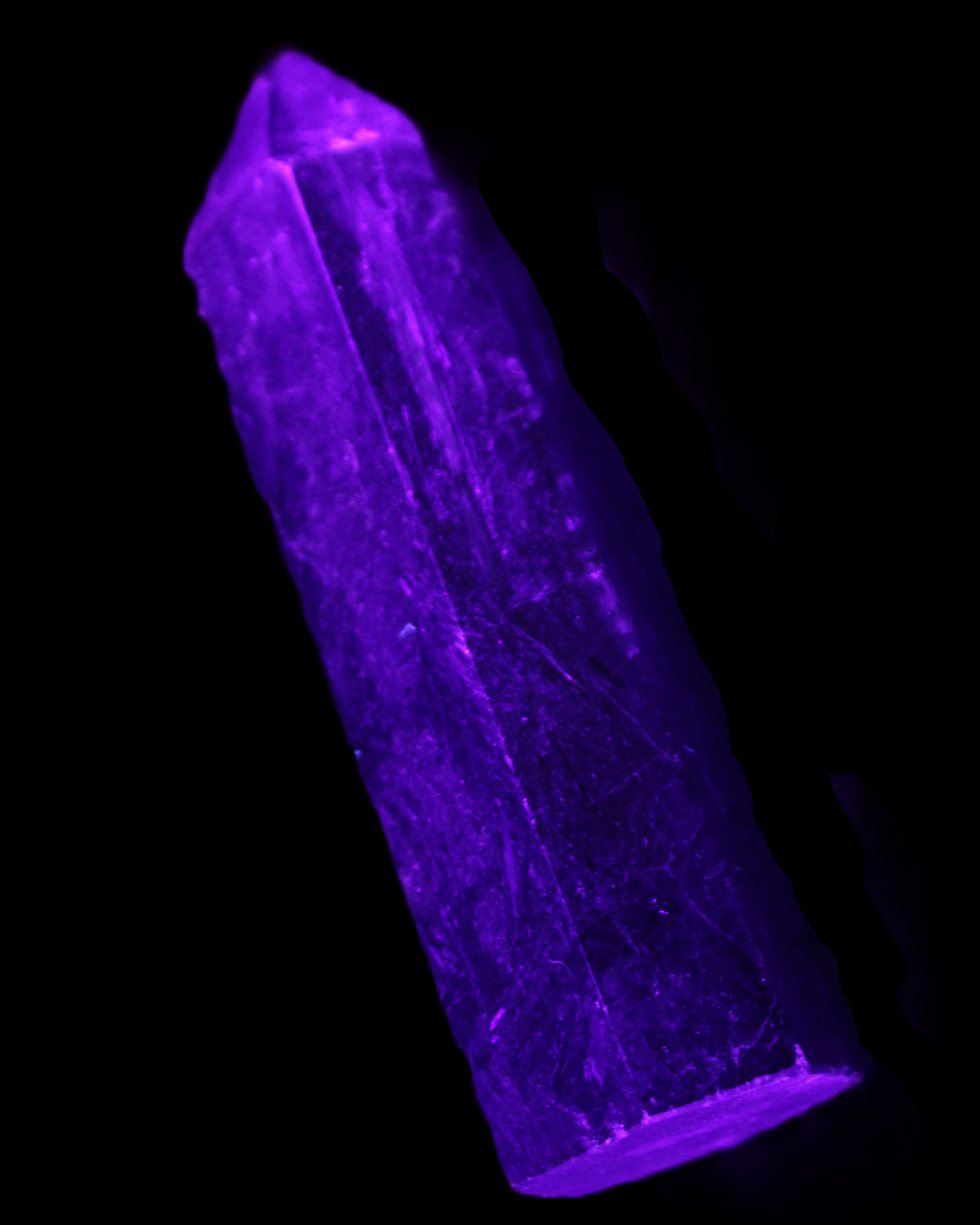 Astrophyllite wand 88mm 100g in UV light - Rocks and Things Store