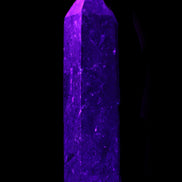 Astrophyllite wand 88mm 100g in UV light - Rocks and Things Store