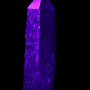 Astrophyllite wand 88mm 100g in UV light - Rocks and Things Store