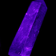 Astrophyllite wand 88mm 100g in UV light - Rocks and Things Store