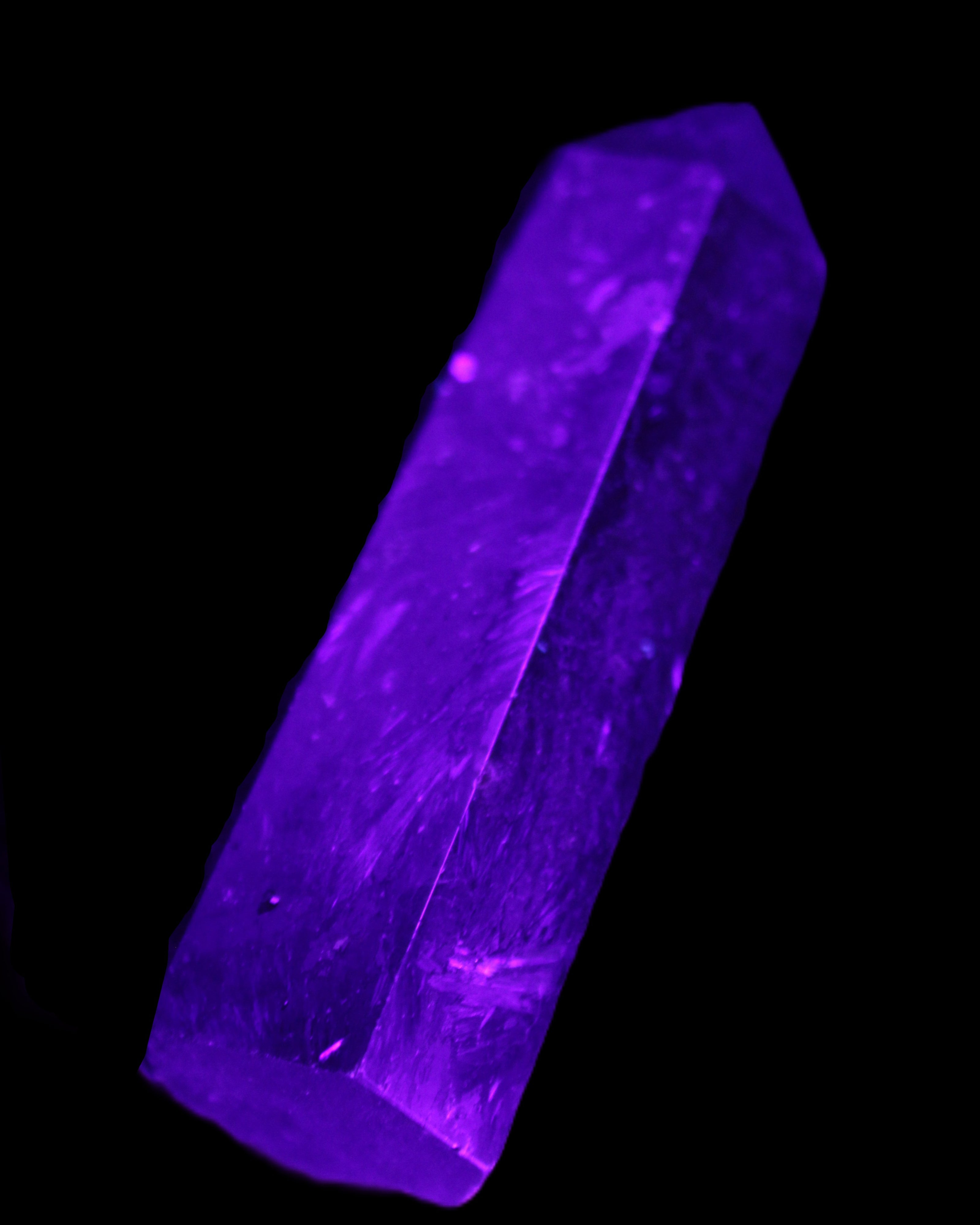Astrophyllite wand 88mm 100g in UV light - Rocks and Things Store