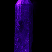 Astrophyllite wand 88mm 100g in UV light - Rocks and Things Store