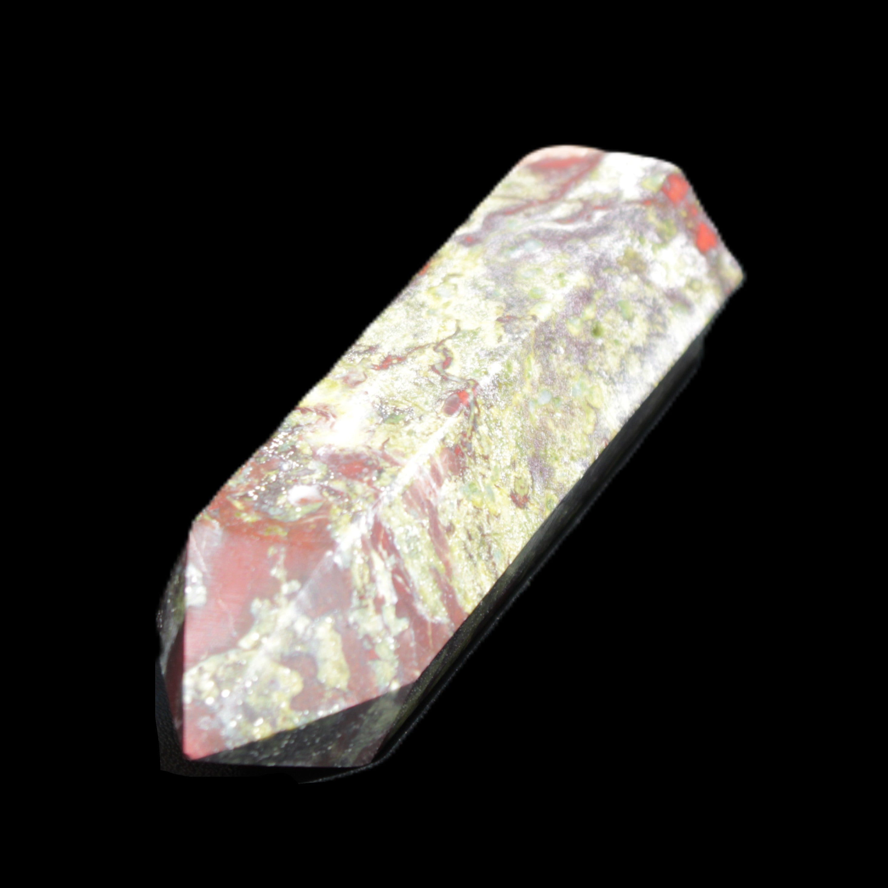 Dragons Blood Stone wand 73mm 70g in sunlight - Rocks and Things Store