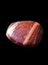 Red Tigers Eye tumbled stone 26/28mm 11/13g in sunlight - Rocks and Things Store