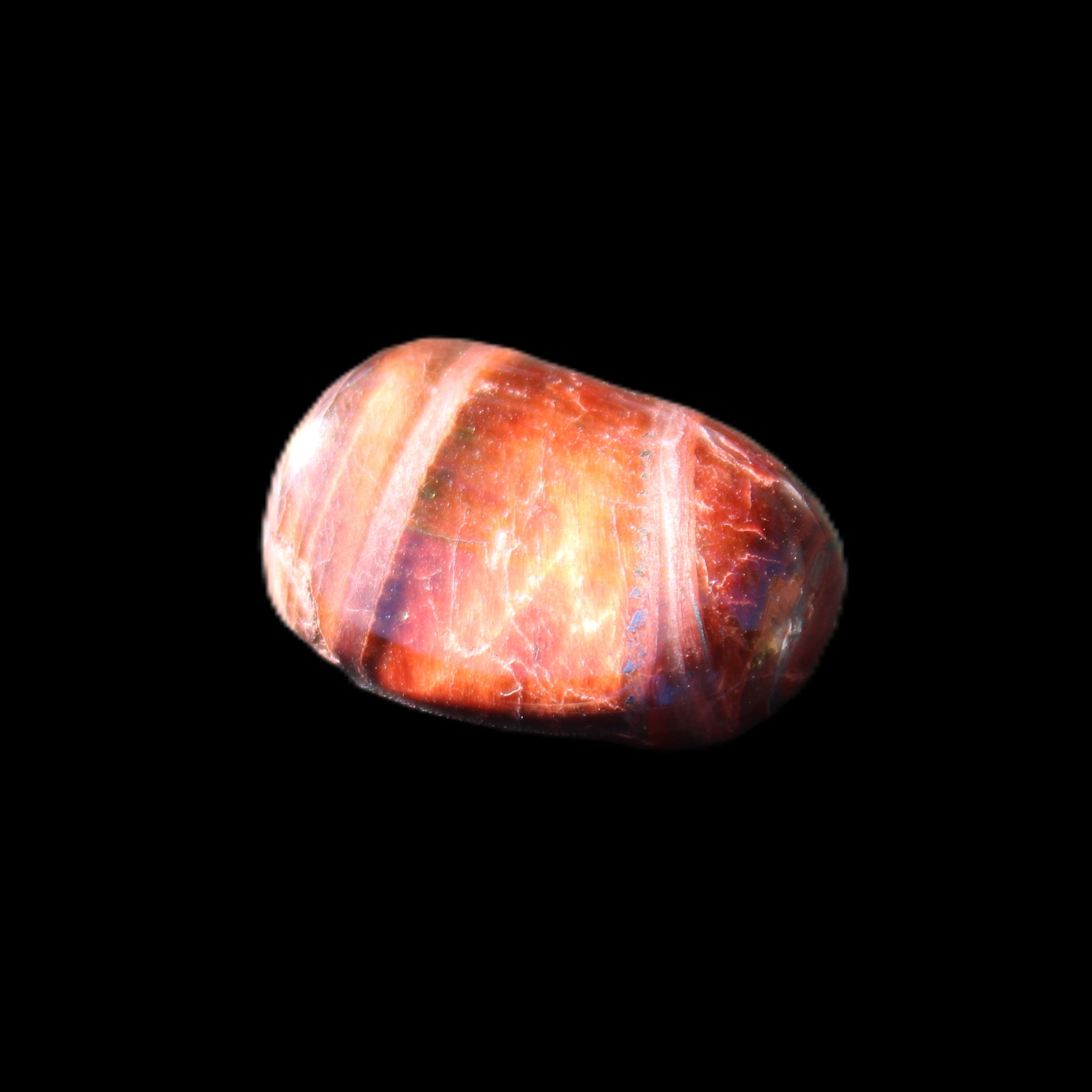 Red Tigers Eye tumbled stone 26/28mm 11/13g in sunlight - Rocks and Things Store